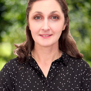 smiling woman with shoulder length brown hair