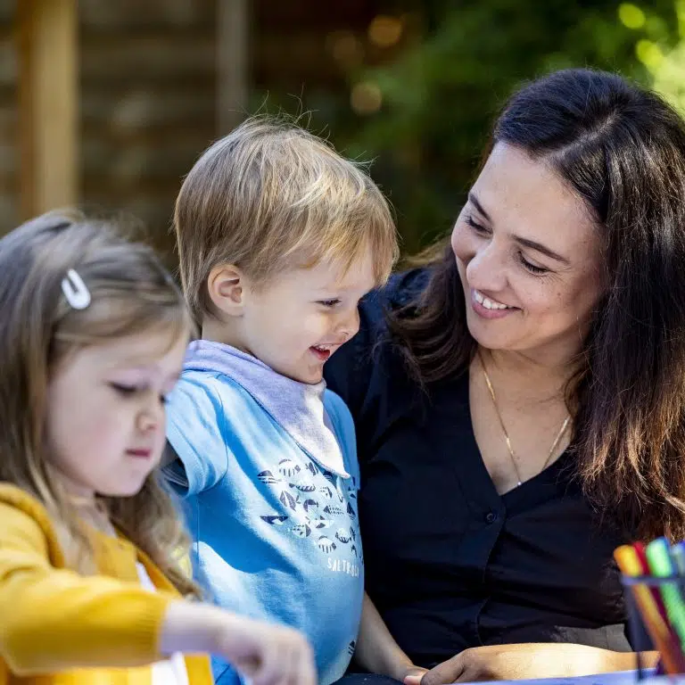 children with their teacher outside