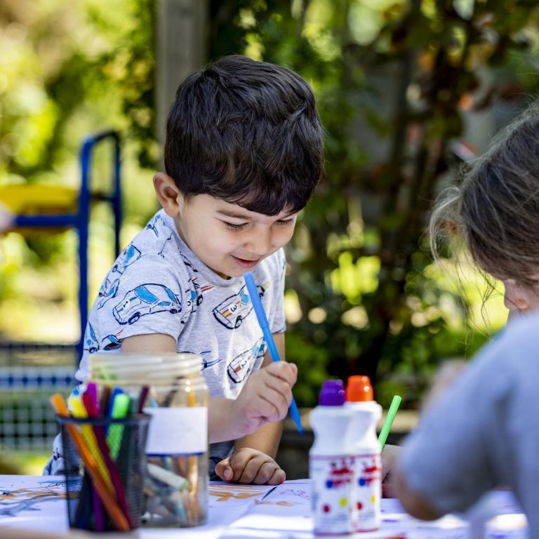 children drawing outside