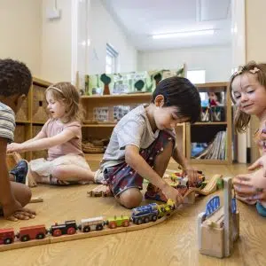 Children playing with wooden toys