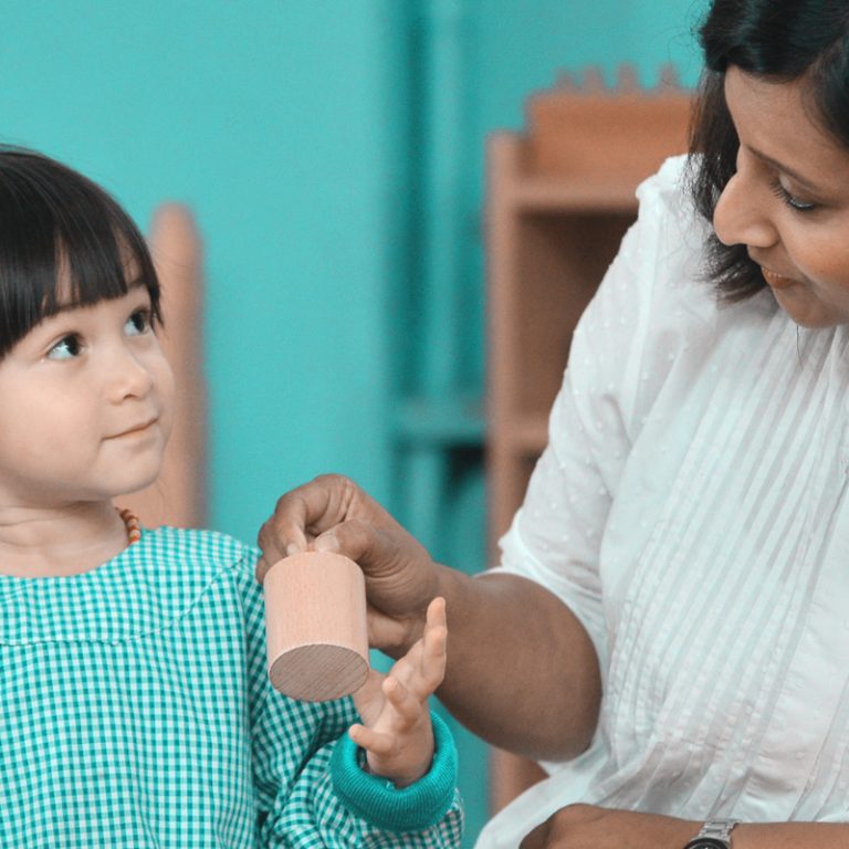 Student working with her teacher