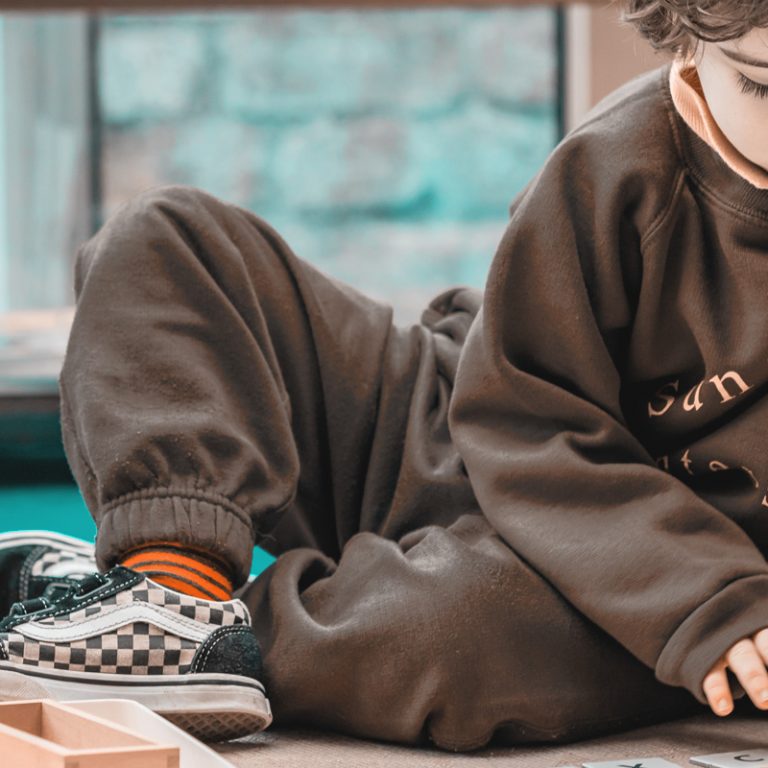 Student working on the floor