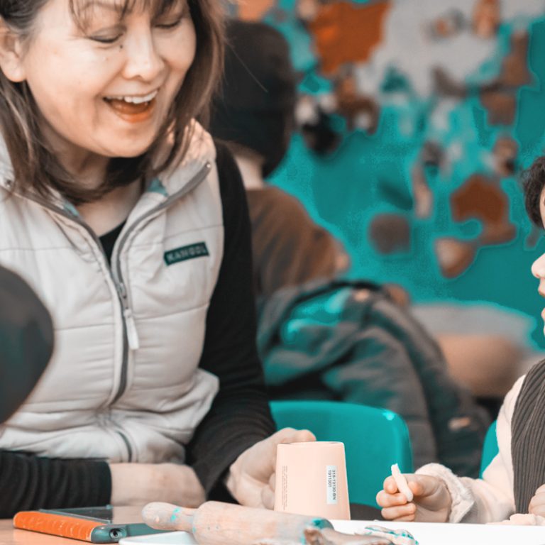 teacher and child smiling