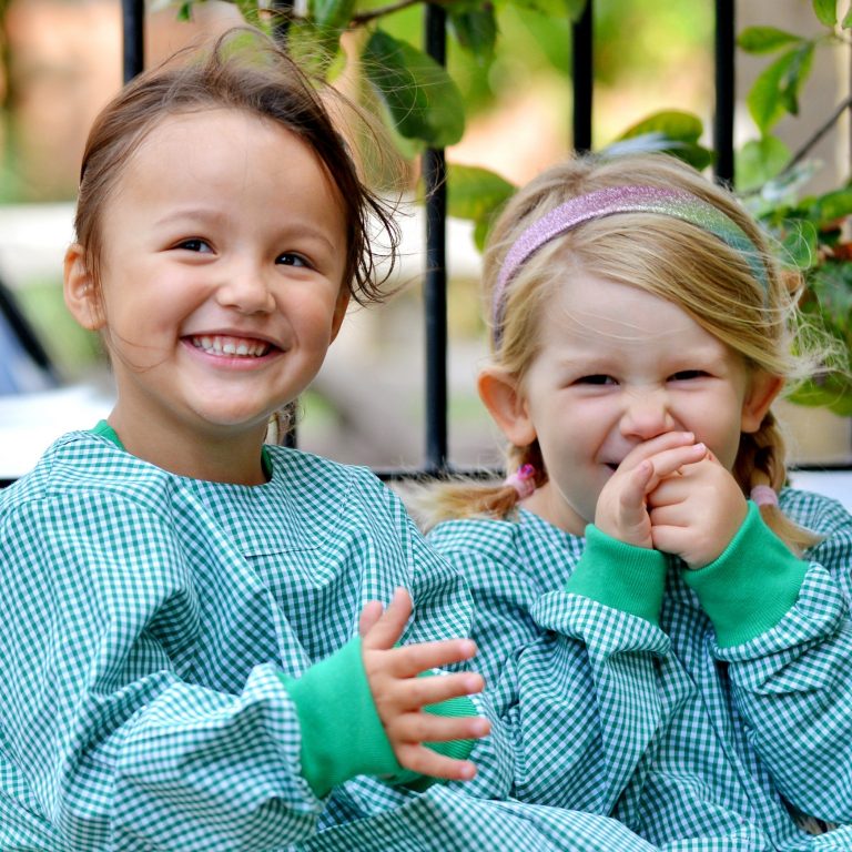 two girls laughing